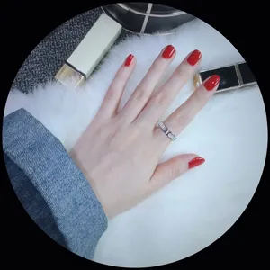 Modern silver chain link ring with mother of pearl and diamonds on a model's hand