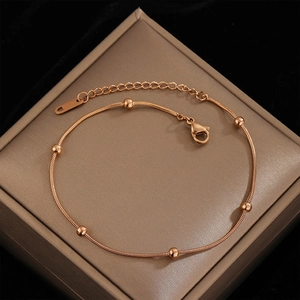 Elegant rose gold snake chain anklet with polished beads and adjustable lobster clasp