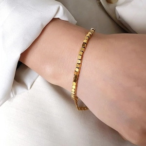 Minimalist gold cube bead bracelet in polished titanium steel for women with extender chain