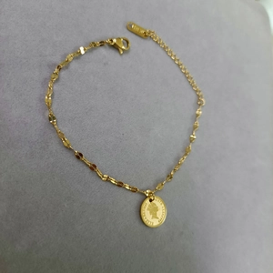 Gold stainless steel bracelet with Queen Elizabeth II coin pendant and lobster clasp