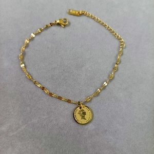 Gold plated 18KGP link chain bracelet featuring a vintage Queen Elizabeth II coin pendant