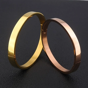 Bracelets joncs minimalistes en acier inoxydable doré et or rose avec fermoir discret