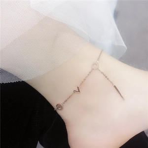 Minimalist silver steel anklet for women featuring elegant letter charms on thin chain