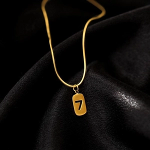 Elegant 18k gold plated titanium steel snake chain necklace with a number 7 pendant