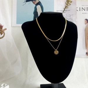 Double layer 18k gold plated titanium necklace with round engraved pendant
