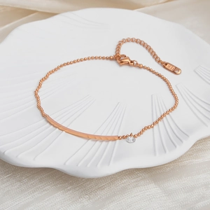18K rose gold titanium steel beaded anklet featuring a curved bar and zircon stone charm