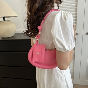 Pink crescent underarm bag for women with knot strap and small matching pouch