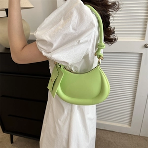 Fashionable light green crescent underarm bag with matching small pouch and slim strap