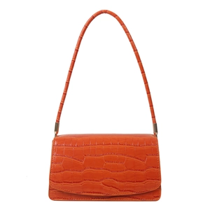 Chic orange crocodile embossed baguette bag with sleek shoulder strap and gold hardware