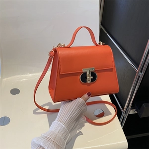 Bright orange PU leather crossbody bag with top handle and gold T-shaped buckle lock