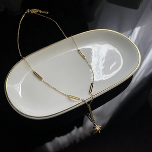 Golden titanium steel tassel necklace with star pendant and crystal on oval tray