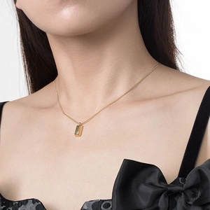 Minimalist gold bar pendant necklace on a delicate chain for women in polished rose gold