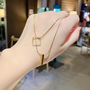 Gold double-layered titanium steel necklace with geometric square and cylinder pendants