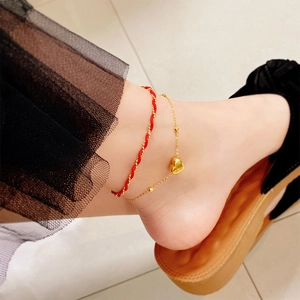 Tobillera de doble capa bañada en oro de 18K con colgante de corazón y cordón rojo tejido