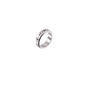 Stainless steel spinner ring featuring celestial star and moon motifs on a white background