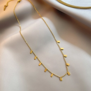 Minimalist 18k gold plated titanium steel necklace featuring eleven rectangular pendants