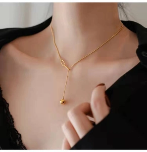 French retro gold beaded Y-shaped tassel necklace shown on a model neck