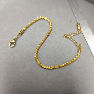Sparkling 18K gold-plated stainless steel star chain bracelet for women on grey velvet