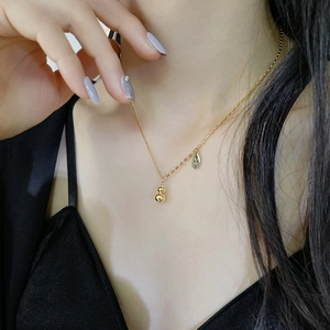 18k gold plated stainless steel gourd necklace with Lucky charm on model