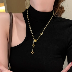 Elegant gold titanium Y-necklace with cylindrical sliding charm and Roman numerals