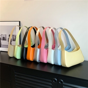 Nine colorful minimalist hobo shoulder bags in vibrant colors like green, orange and pink