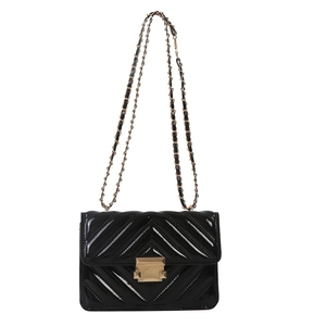 Women's black patent leather shoulder bag with V-quilted texture and gold chain strap