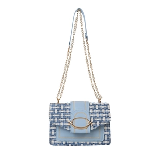 Elegant light blue tweed chain shoulder bag with gold oval buckle on white background