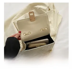 Interior view showing capacity for a smartphone and wallet in a quilted chain bag