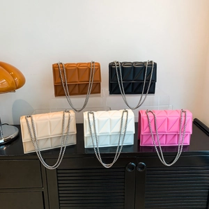 Quilted crossbody bags with triangle stitching and chain straps in five trendy colors