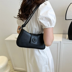 Minimalist black matte underarm bag with unique buckle and knot strap detail