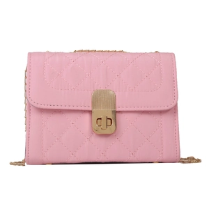 Quilted pink crossbody bag with gold chain strap and turn-lock closure in chic style