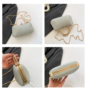Detail views of silver glitter evening clutch bag with gold frame and gem buckle