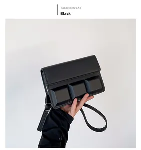 Detail showing the 3D embossed square pattern on a black rectangular PU leather bag