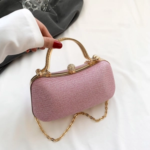 Elegant pink sequin evening clutch bag with gold metallic handle and rhinestone closure