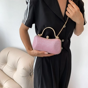 Pink sequin hard shell evening clutch with gold metal handle and chain strap for parties