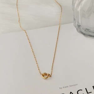 Minimalist 18K gold-plated titanium steel necklace featuring a polished knot pendant design