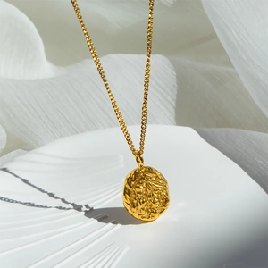 French style 18K gold plated titanium necklace with irregular embossed lava pendant