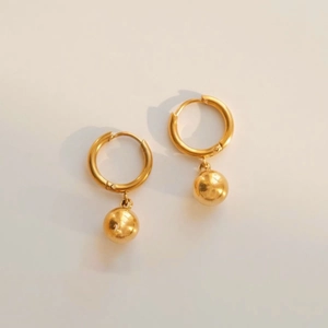 Minimalist gold titanium steel hoop earrings with polished bead pendants for women