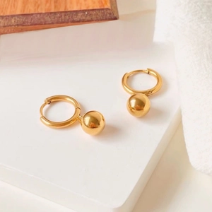 Minimalist gold ball hoop earrings for women with polished spherical charms in warm setting