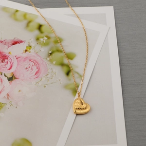 Golden heart necklace with honeycomb texture and Forever engraving on fine chain