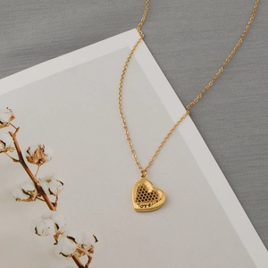 Golden heart necklace with honeycomb texture and Forever engraving on fine chain