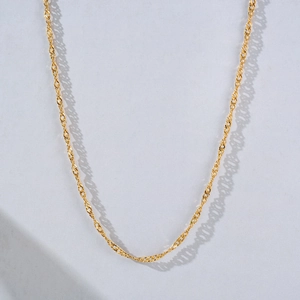 Minimalist gold titanium steel water wave chain necklace with shiny metallic finish