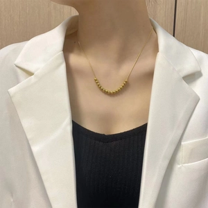 18K gold-plated titanium snake chain necklace featuring elegant multiple gold bead accents