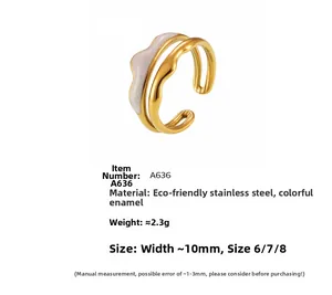 Detailed view of mountain-style double-layer gold ring with white enamel and wave design
