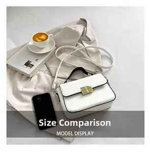 Mini white leather crossbody bag shown next to a smartphone for size comparison