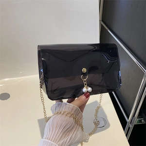 Sac à main transparent noir en PVC avec chaîne dorée et perles pour la plage d'été