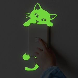 Luminous cat switch wall decal glowing in the dark with green fluorescent effect
