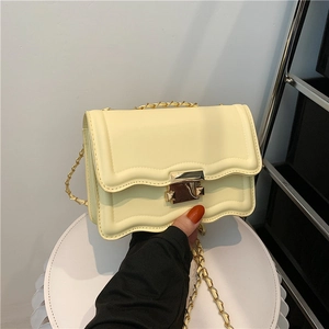 Chic cream small square bag with wavy flap design and gold chain strap for women