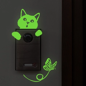 Glow-in-the-dark cat and butterfly luminous stickers showing fluorescent green effect