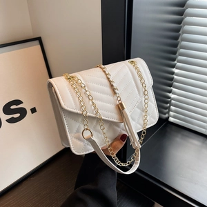 Elegant white quilted crossbody bag with gold chain strap and tassel charm